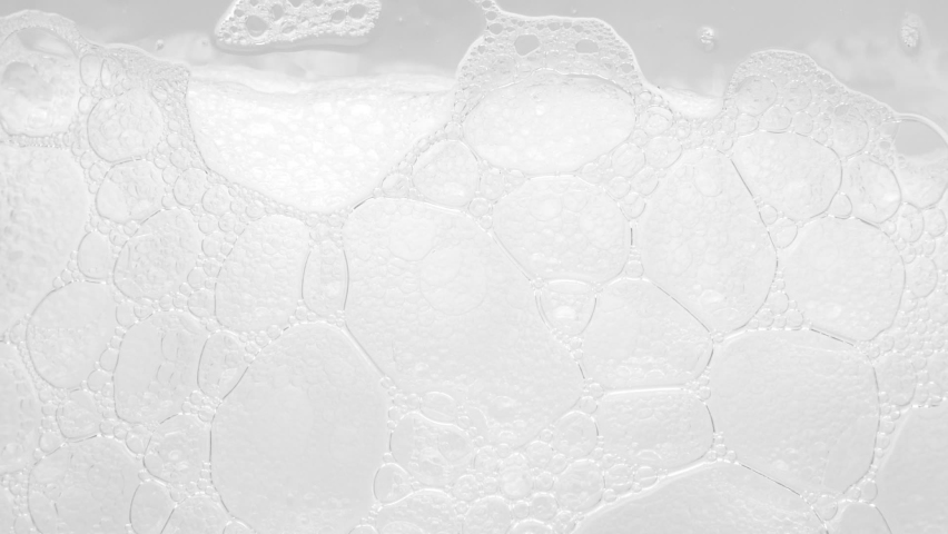 Texture of white soap foam with bubbles in the bathroom. Foam Bubbles - Bathtup Soap Foam - Foamy Bubble Texture Background Royalty-Free Stock Footage #1076374871