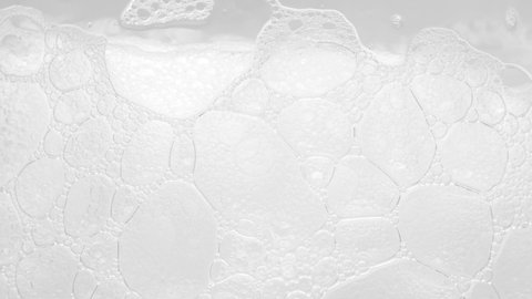 Texture of white soap foam with bubbles in the bathroom. Foam Bubbles - Bathtup Soap Foam - Foamy Bubble Texture Background
