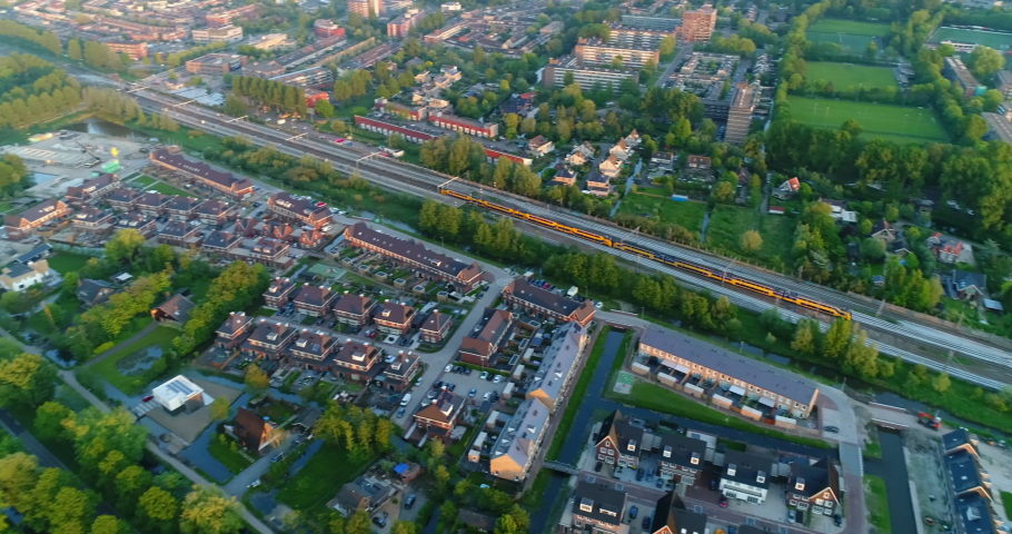 NS Train Traveling Within Gouda City In South Holland, Netherlands. aerial | Shutterstock HD Video #1076377154