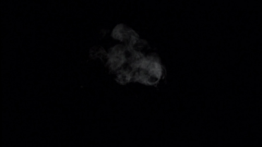 Soft Fog in Slow Motion on Dark Backdrop. Realistic Atmospheric Gray Smoke on Black Background. White Fume Slowly Floating Rises top view.