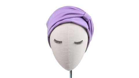 Turban hat with arabic hat style on mannequin head with hair accessories isolated headpiece. This turban fashion is very elegance, stylish, and modern. Indian hat with beautiful and casual design.