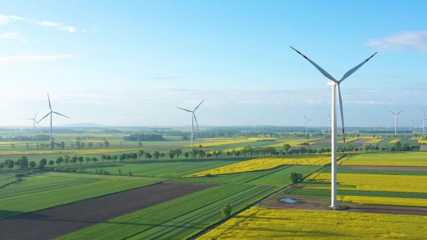 Wind turbines in the rape field - aerial footage | Shutterstock HD Video #1076405291