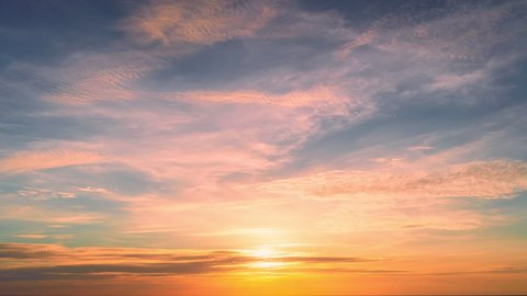 Amazing nature cloudscape Time Lapse colorful pastel clouds at sunset or sunrise time Golden hour weather perfect for digital cinema composition background Timelapse of clouds moving fast over sky