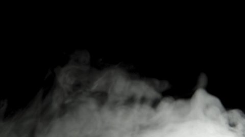Mystical white steam moves on a black background. Thick clouds. Close-up, 4K UHD
