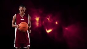Animation of basketball player holding ball over light trails. global sports, fitness, science and data processing concept digitally generated video.
