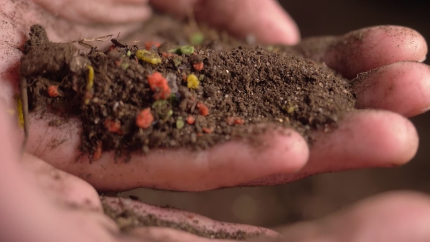 Microplastics in soil. micro plastic in sea, freshwater, land environment and organisms. plastic rubbish in the oceans and soil. soil ecosystems, agricultural land, agriculture, farming. | Shutterstock HD Video #1076429771