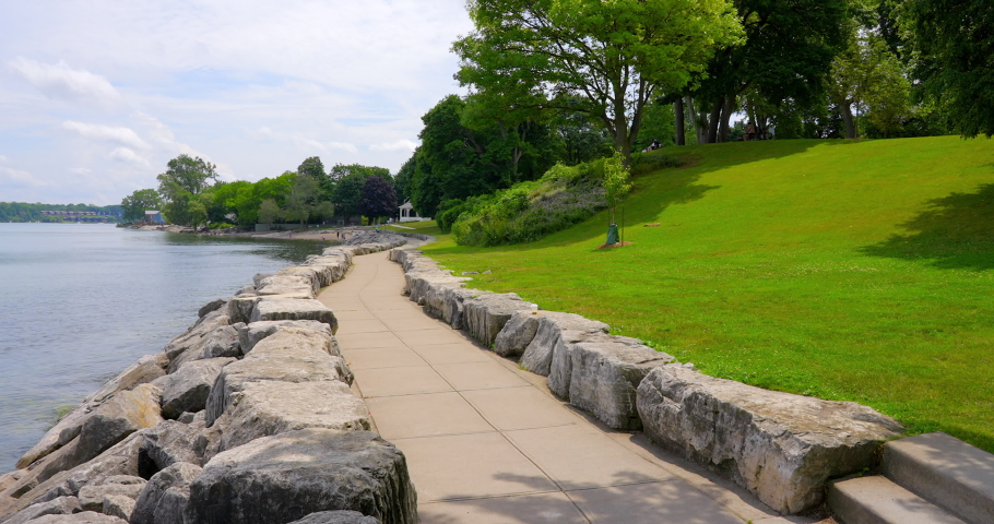 Establishing shot of Lake with White Clouds in Toronto, Canada, North America. Day time on July 2021. Still camera view. ProRes 422 HQ.