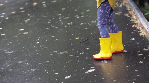 Walk in the rain in rubber boots