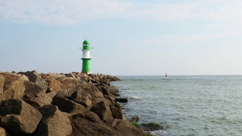 Lighthouse of Warnemuende and coastline of baltic sea in Rostock
