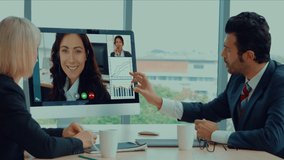 Creative visual of business people in a corporate staff meeting on video call . Concept of digital technology for marketing data analysis and investment decision making . - Powered by Shutterstock - Get 15% off with code: PIKWIZARD15