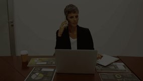Animation of financial data processing over businesswoman using smartphone in office. global business, technology concept digitally generated video.
