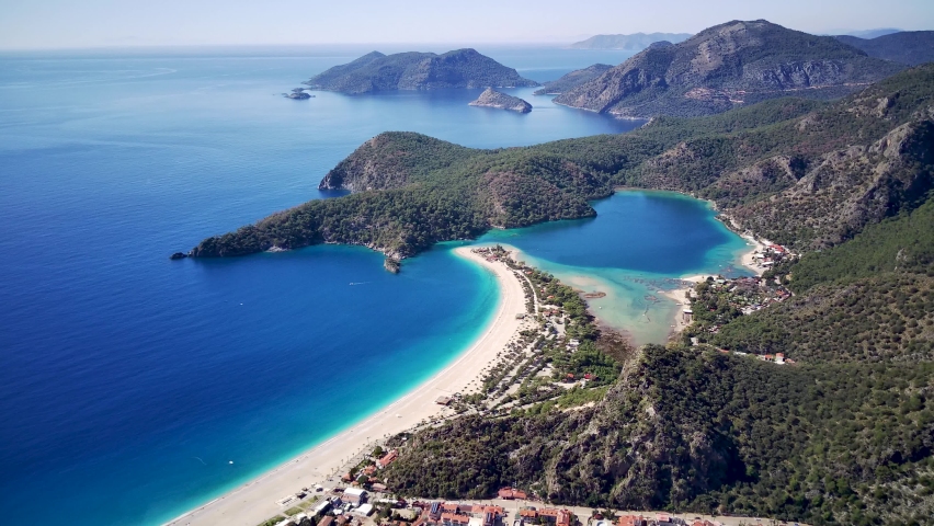 Amazing beautiful panoramic view from drone of natural park of Oludeniz and Fethiye blue lagoon and tranquil aquamarine dead sea.
 Royalty-Free Stock Footage #1076454254