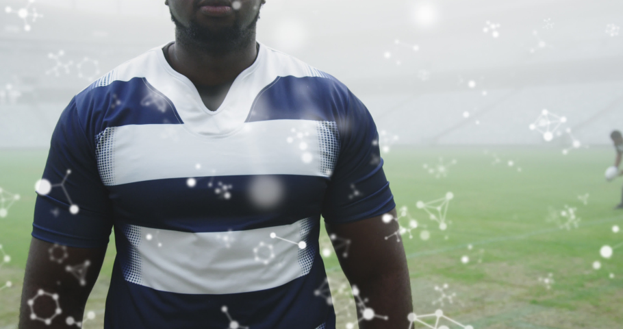 Animation of chemical structures over male rugby players at stadium. sport and competition concept digitally generated video.