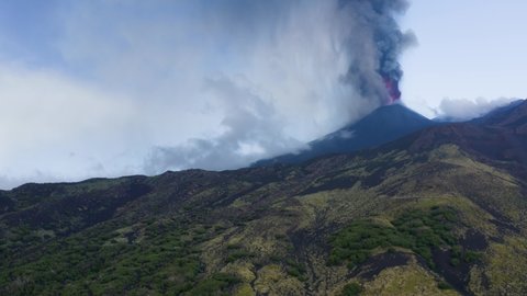 Paroxysmal activity of the Etna volcano during the day 20 July 2021. Explosions, lava and columns of smoke that have covered the neighboring Etna villages with ash and lapilli.