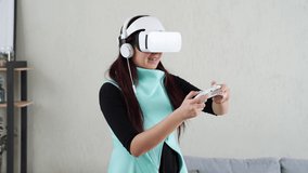 Woman is playing game with virtual reality headset and joystick.