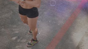 Animation of network of connections over fit woman wearing earphones. global connections, sports, fitness and data processing concept digitally generated video.