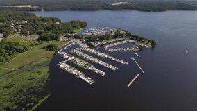 Drone footage of a pier with boats lined up in Lake Ekoln, Sweden