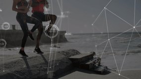 Animation of network of connections over woman and man exercising outdoors. global sports, fitness, data processing and digital interface concept digitally generated video.