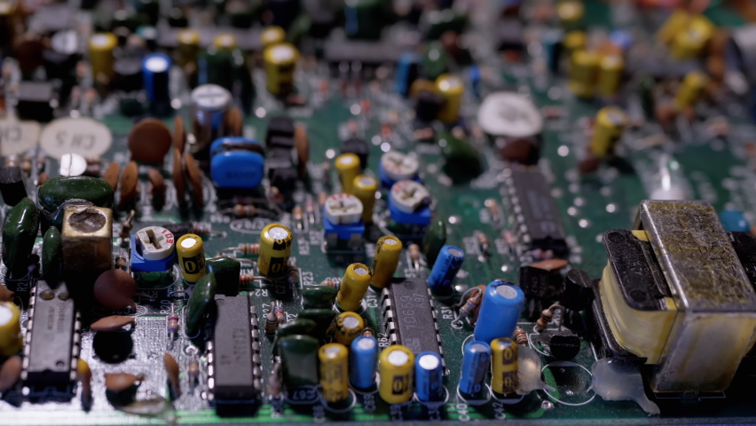 Lots Old Boards with Radio Components, Transistors, Chips, Resistors, Capacitor. Electronic circuit boards of retro TVs with preciou metal, gold, platinum, silver, tantalum. Scheme. 4K. Slow-motion.