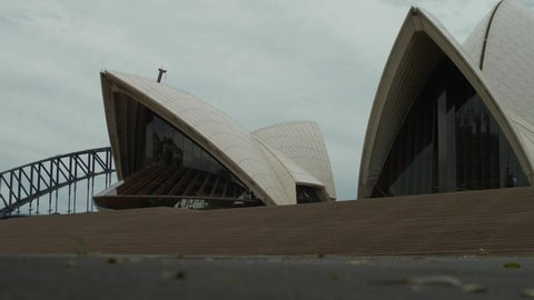 SYDNEY, NSW, AUSTRALIA. DECEMBER 18 2020. Leaves blow in the wind at the Sydney Opera House, slow motion.