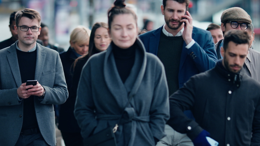 Crowd of Business People Tracked with Technology Walking on Busy Urban City Streets. CCTV AI Facial Recognition Big Data Analysis Interface Scanning, Showing Animated Information. Royalty-Free Stock Footage #1076499041