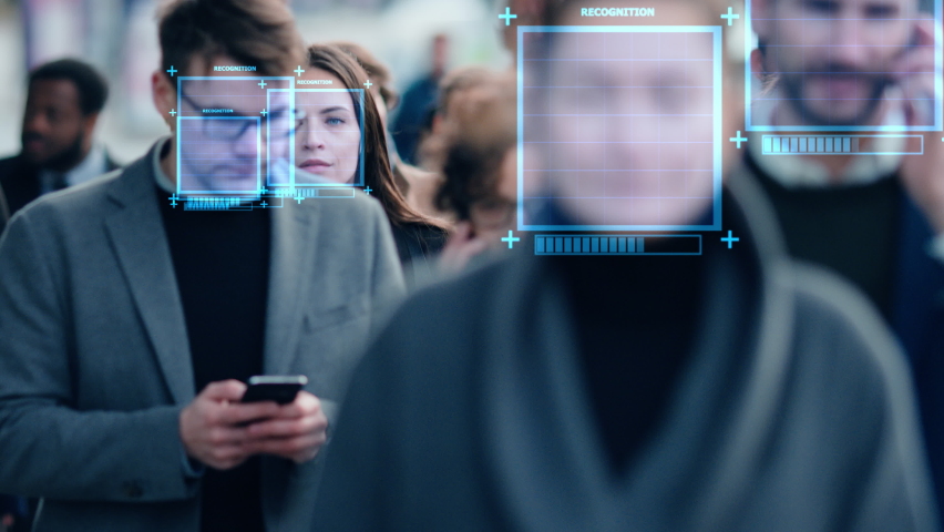 Crowd of Business People Tracked with Technology Walking on Busy Urban City Streets. CCTV AI Facial Recognition Big Data Analysis Interface Scanning, Showing Animated Information. Royalty-Free Stock Footage #1076499041