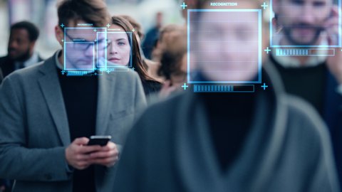 Crowd of Business People Tracked with Technology Walking on Busy Urban City Streets. CCTV AI Facial Recognition Big Data Analysis Interface Scanning, Showing Animated Information.