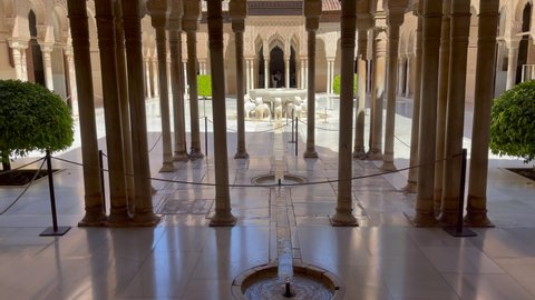 Granada, Spain - July 05, 2021; Patio de Los Leones in Granada with many columns in the foreground