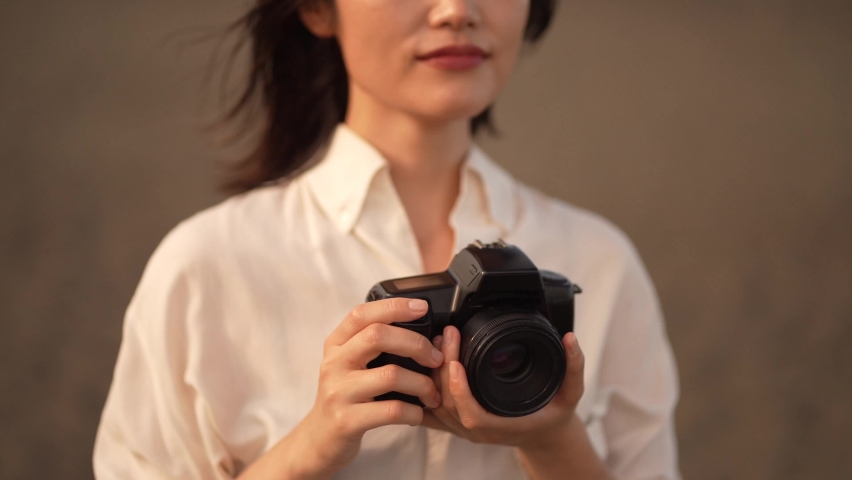 Image of a woman taking a picture 
