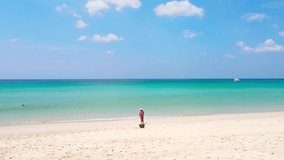 Phuket beach sea sand and sky. Panoramic view Landscape view of beach sea in summer day. Beach space area. At Karon Beach, Phuket, Thailand. On 15 June 2021. 4K UHD. Video Clip
