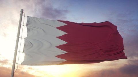 Flag of Bahrain waving in the wind, sky and sun background
