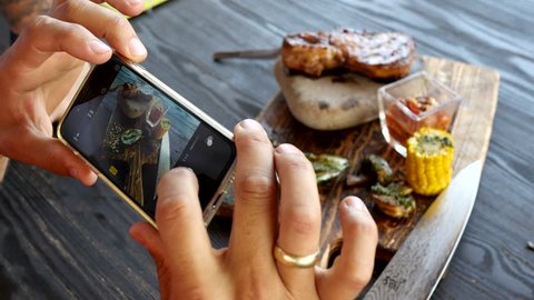 take a photo of food in a restaurant with mobile phone camera for social network
