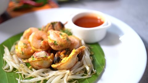 Pad Thai,Thai traditional food, stired noodles with shrimps, egg served with lemon and vegetable. Pad Thai is popular on street food in Thailand, Clean food good taste concept.