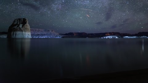 Lake Powell Lone Rock and Startrails of Milky Way Galaxy Tilt Up Utah USA Astrophotography Time Lapse