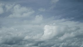 Blue sky white clouds. Puffy fluffy white clouds. Cumulus cloud cloudscape timelapse. Summer blue sky time lapse. Nature weather blue sky. White clouds background. Cloud time lapse nature background.