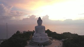 aerial view scenery sunset with rain clouds moving summer.
beautiful silhouette Phuket big Buddha on hilltop.
Another incentive to attract tourists to visit. 4k video for travel and worship concept.