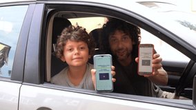 Europe, Italy , Green Pass European Eu Digital Covid-19 Coronavirus passport Certificate to travel - Father and son boy 7 years old ready to go on a trip with screenshots of the vaccination - Powered by Shutterstock - Get 15% off with code: PIKWIZARD15