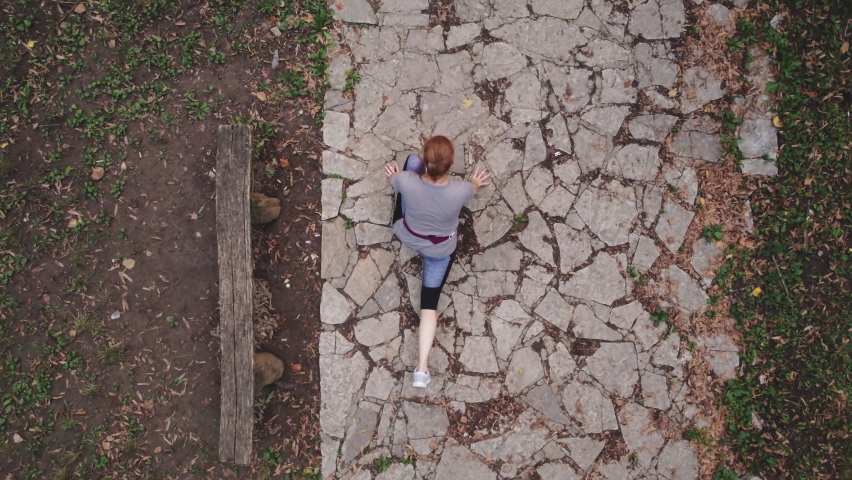 Aerial view of a female while training in the park.