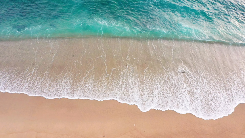 4K Aerial drone top down view bird eye view of sea blue waves break on rock and sand. Beautiful of sea water wave come to beach. Phuket Thailand tropical beach | Shutterstock HD Video #1076589791