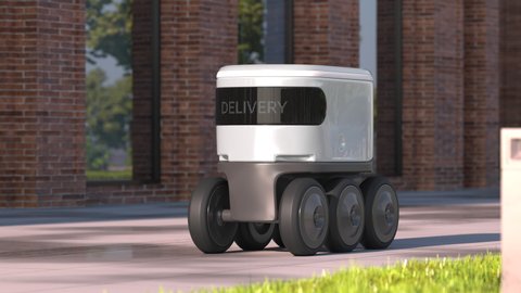 Automatic delivery robot driving down the morning street after rain