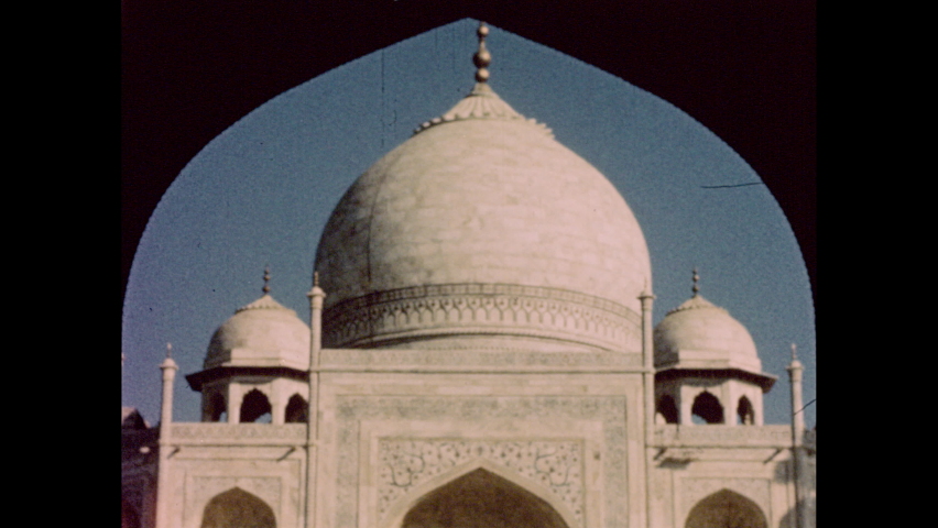 India 1950s: Dome of a mosque framed by a doorway. A Hindu temple. Crowd of people in a market. Map of India and Pakistan.