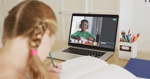 Schoolgirl using laptop for online lesson at home, with her school friend and web chat on screen. global communication technology and online elementary education concept, digital composite video.