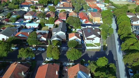 Panorama aerial drone view of suburban Sydney residential housing and street scapes parked and roads of NSW Australia