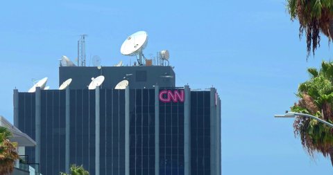 LOS ANGELES, CALIFORNIA, USA - JULY 25, 2021: CNN communication broadcast tower and satellite antennas broadcasting breaking news on Sunset Boulevard in Los Angeles, California