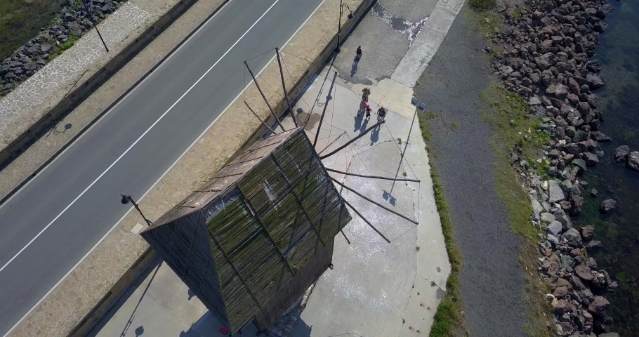 Timelaps. Drone Circling video of the Old windmill in the ancient town of Nesebar in Bulgaria. UNESCO world heritage site.