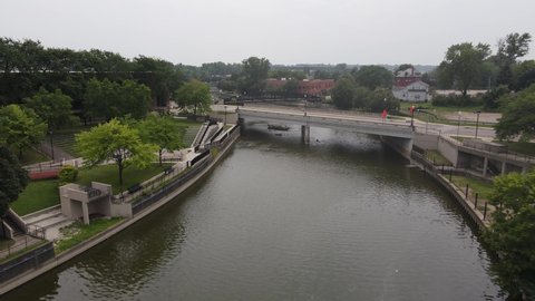 Flint River in Flint, Michigan drone shot over river and bridges.