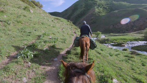Incredible Beautiful Horse riding in Kyrgyzstan. Incredible landscapes. Mountains and alpines lakes nad rivers