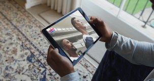 Composite of man sitting at home watching rugby match on tablet. sports, competition, entertainment and technology concept digitally generated video.