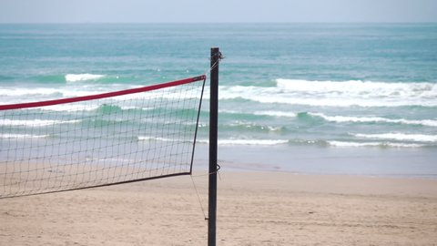 Beach volleyball net on the empty beach in slow motion 250fps