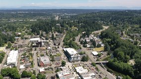 Cinematic 4K aerial drone trucking footage of downtown Bothell, an upscale, affluent neighborhood between Kenmore and Woodinville, near Seattle Washington